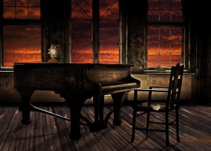 grand piano in empty room again sunset windows